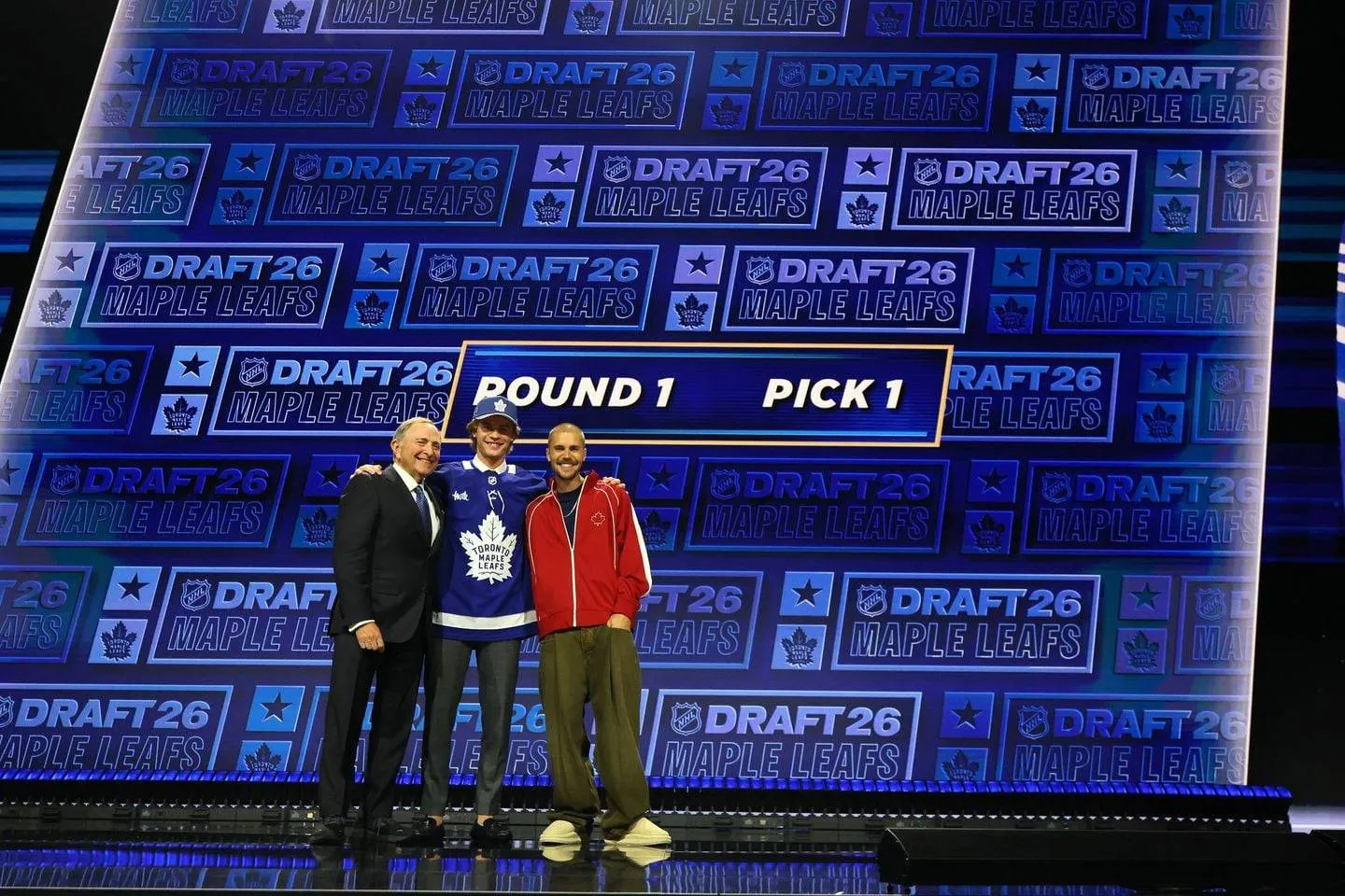 Bettman, McKenna, Bieber on stage