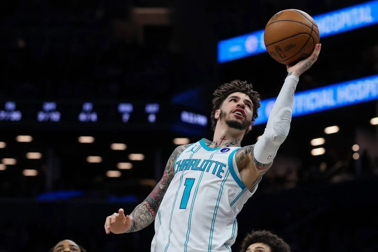 LaMelo Ball leans in with a shot at the basket