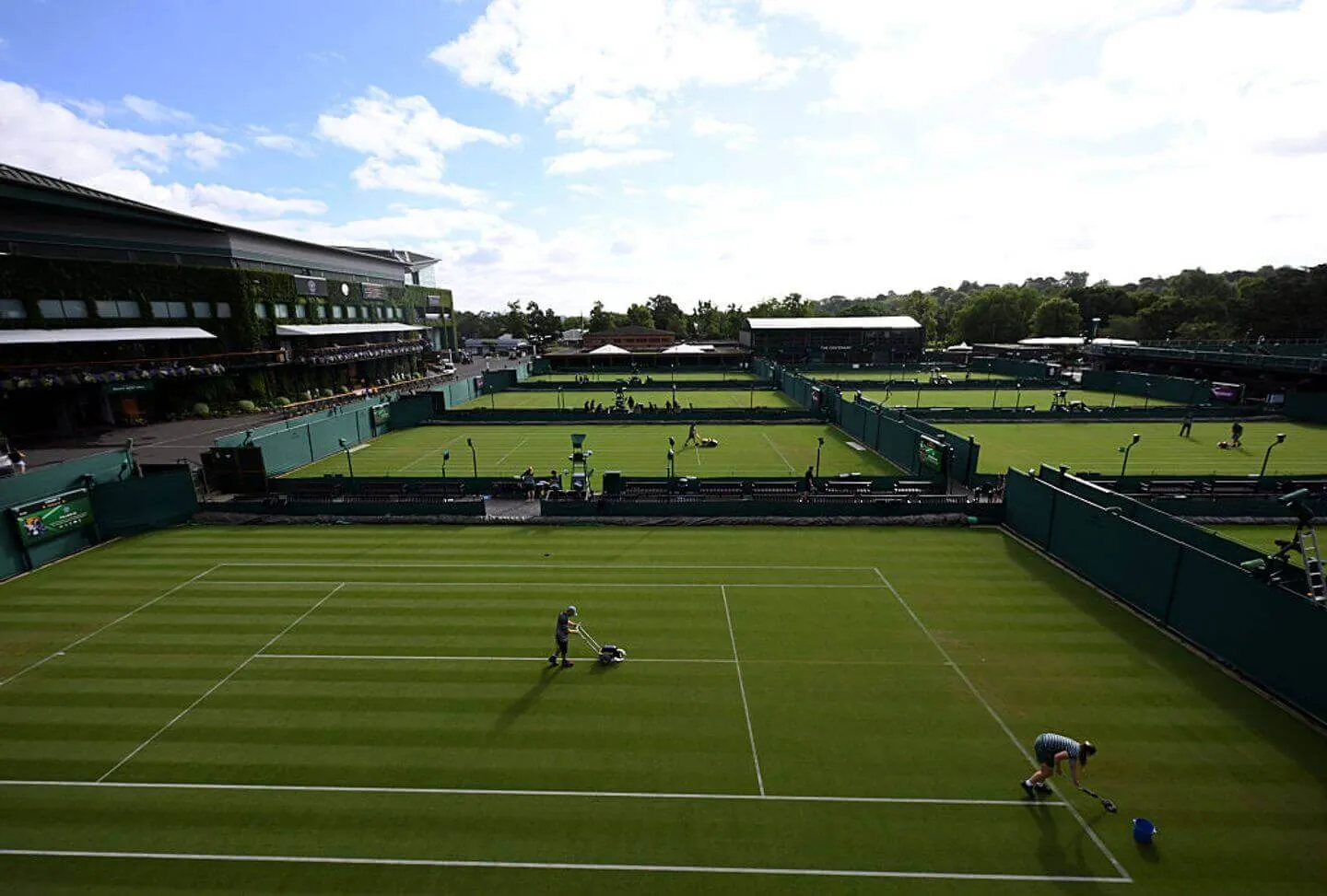 A general view as a member of ground staff paints the lines on court on day one of The Championships Wimbledon 2026 at All England Lawn Tennis and Croquet Club on June 29, 2026 in London, England.