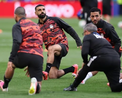 Mo Salah warms up with teammates ahead of kick-off between Egypt and Iran in Seattle.