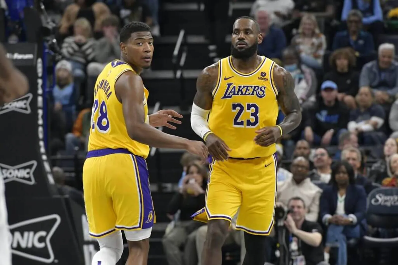 Los Angeles Lakers forwards Rui Hachimura (28) and LeBron James (23) play in the first half of an NBA basketball game against the Memphis Grizzlies Wednesday, March 27, 2024, in Memphis, Tenn. (AP Photo/Brandon Dill)