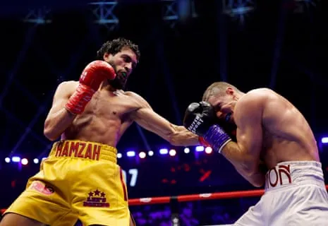 Hamzah Sheeraz lands a shot on Simon Zachenhuber.