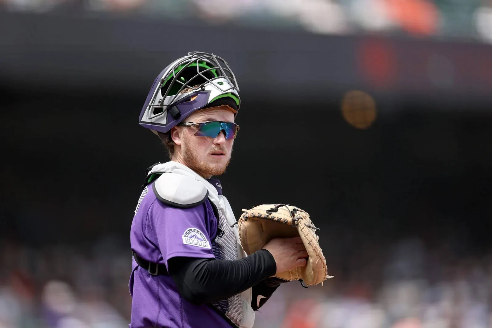 Hunter Goodman #15 of the Colorado Rockies looks back towards the dugout against the San Francisco Giants at Oracle Park on July 12, 2026 in San Francisco, California.