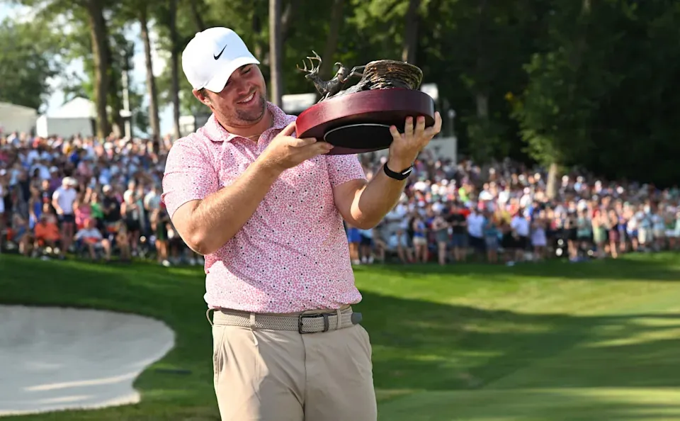 Chris Gotterup admires the trophy after winning the 2026 John Deere Classic at TPC Deere Run in Silvis, Illinois.
