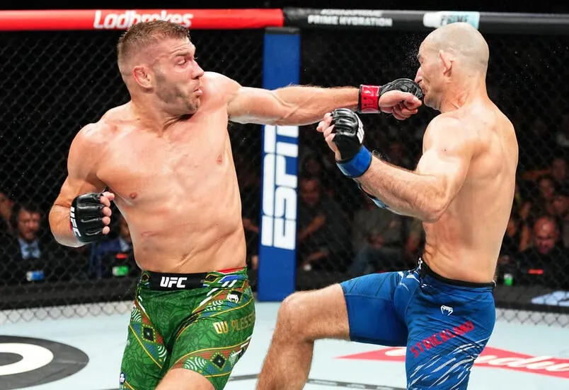 Dricus Du Plessis lands a spinning backfist against Sean Strickland in the UFC middleweight championship fight during the UFC 312 event at Qudos Bank Arena on February 09, 2025 in Sydney, Australia. (Photo by Jeff Bottari/Zuffa LLC)