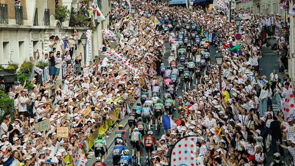Fans watch the final stage of the Tour de France in Montmatre