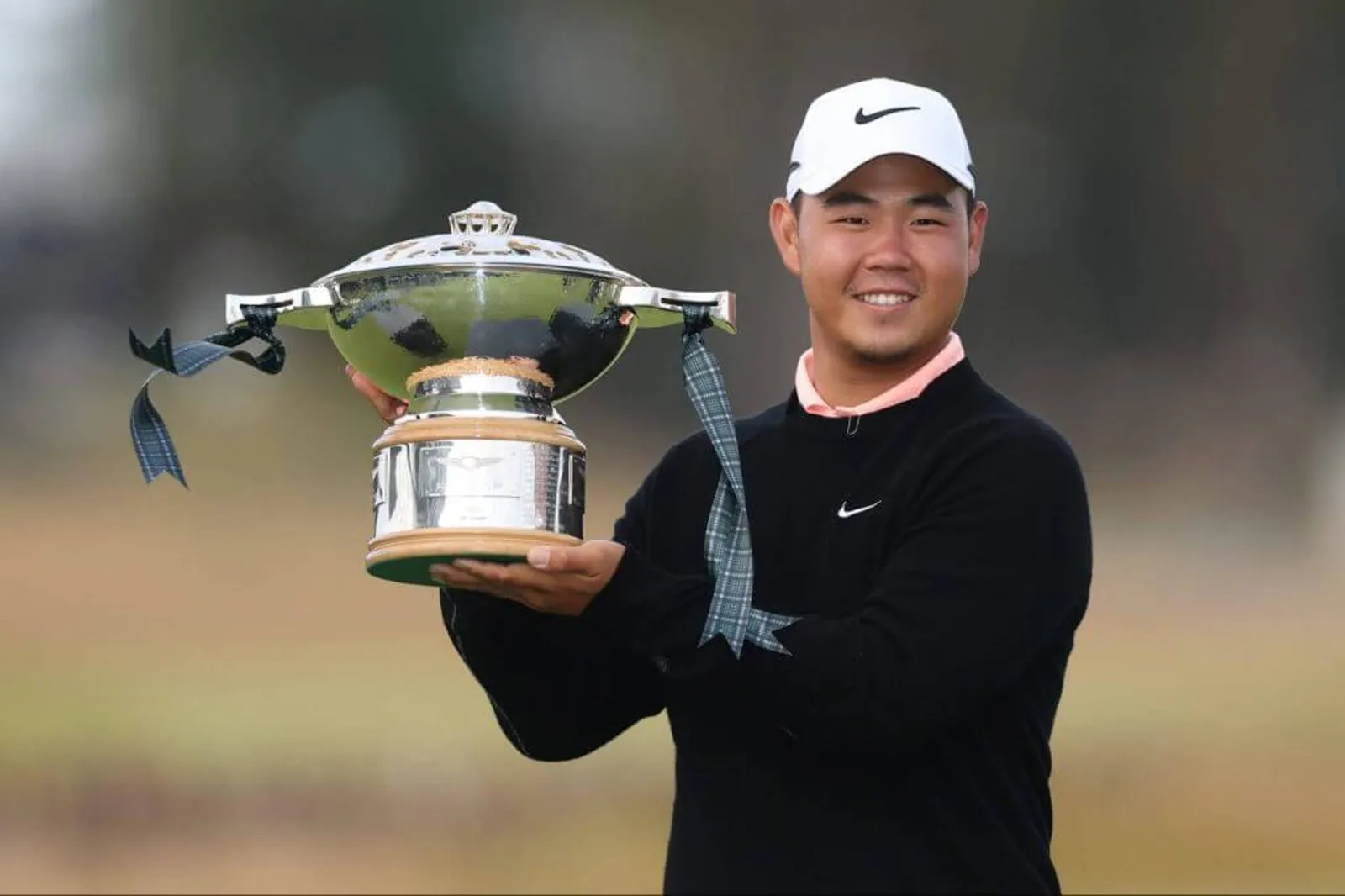 Tom Kim of South Korea poses with the trophy following victory on day four of the Genesis Scottish Open 2026 at The Renaissance Club.