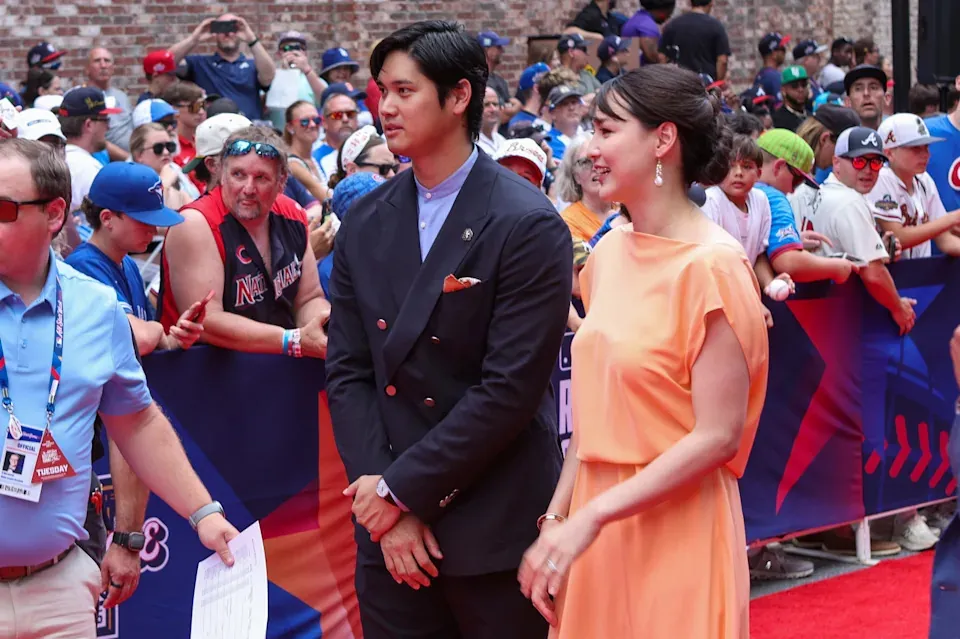 Shohei Ohtani and wife Mamiko Tanaka walk on the red carpet before the 2025 MLB All Star Game at Truist Park.