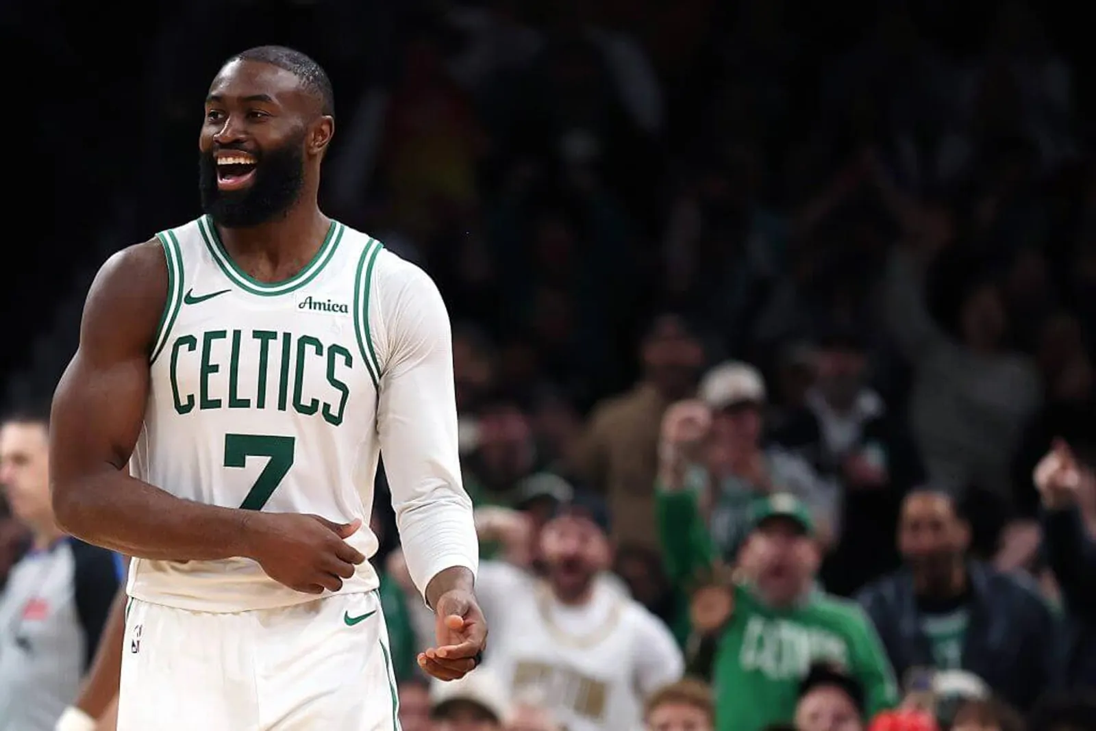 Jaylen Brown smiles during an NBA game.